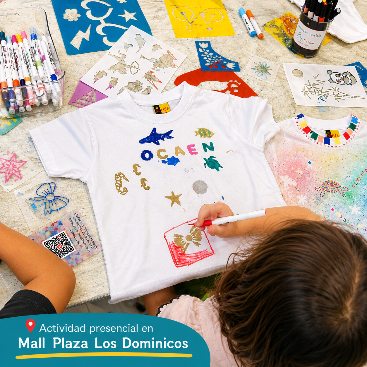 nina pintando polera en taller